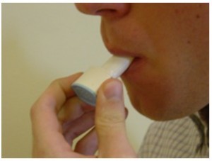 photo of a person using the dry powder inhaler